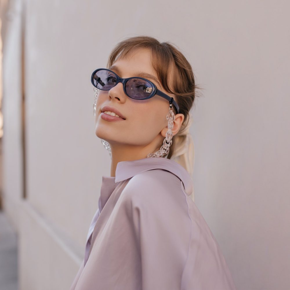 close-up-portrait-of-young-girl-in-city-pretty-brunette-wearing-silk-outfit-purple-sunglasses-wit.jpg